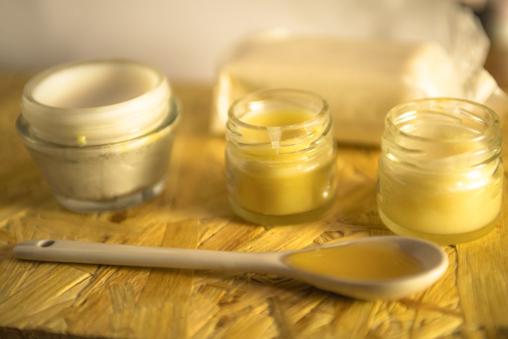 Homemade lip balm and facial cream with honey and cocoa butter.