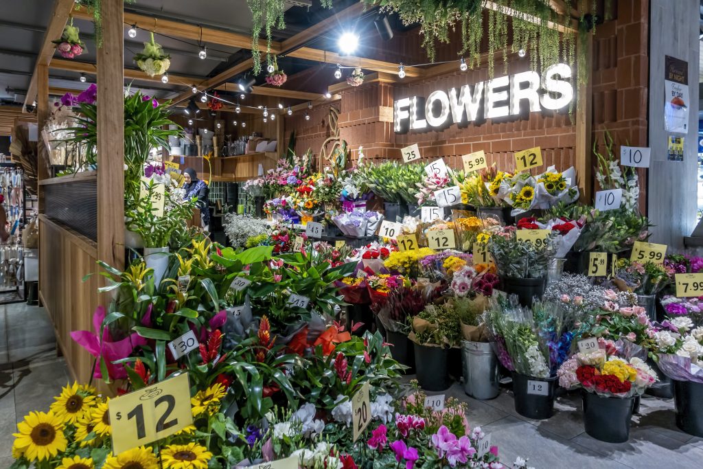 Sydney, Australia - Mar 10, 2021: Florist's assorted flower display at front of the store in Roselands Shopping Centre. A representation of an Australian small business.