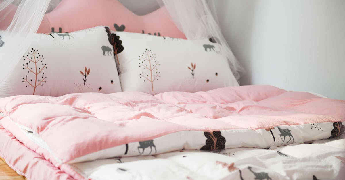 a cozy bedroom with pink bedding and animal patterns perfect for