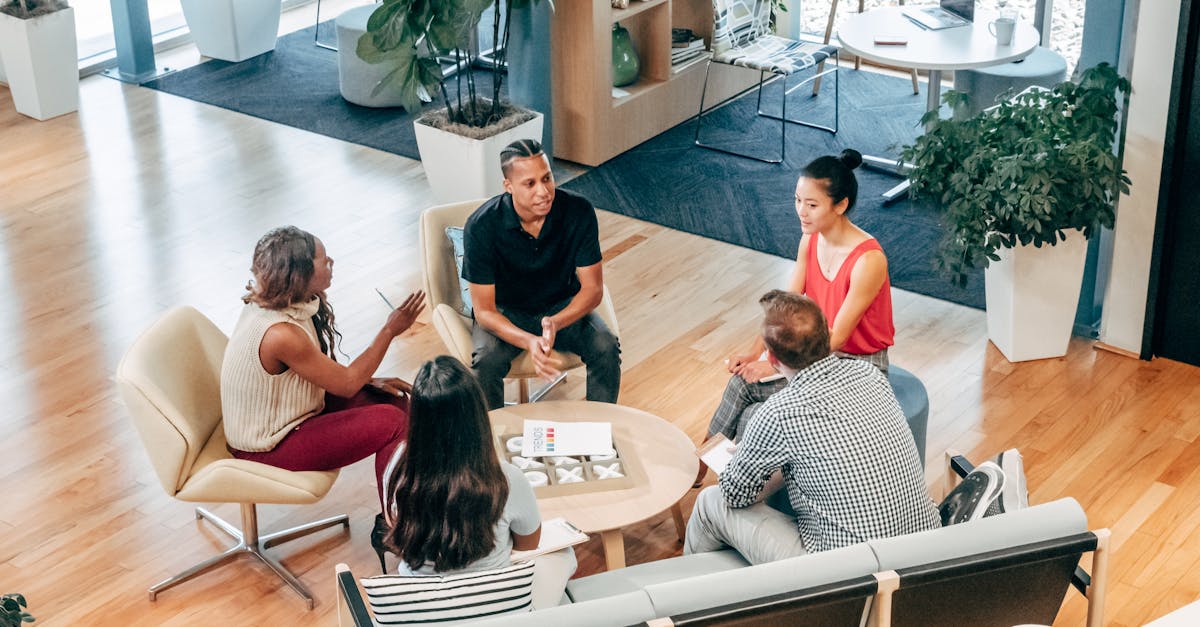 a diverse group of professionals engage in a collaborative team meeting in a stylish office environm 5