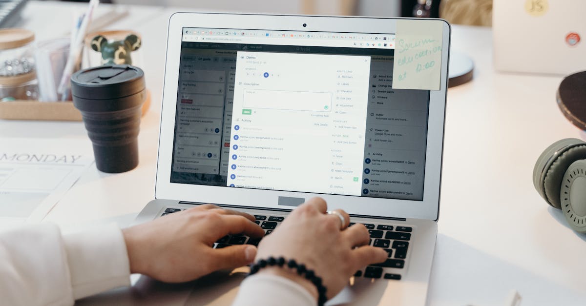 a person typing on a laptop in a bright modern office setting showing productivity and technology