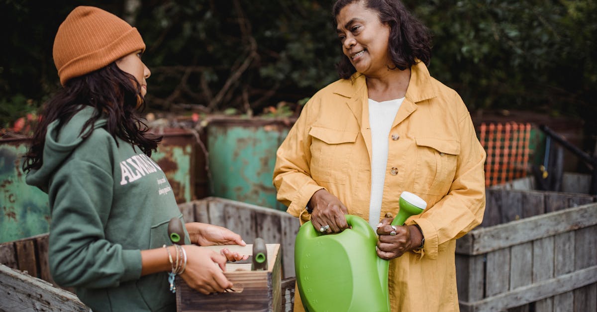 a woman and her daughter engage in outdoor gardening sharing a moment with tools in hand 1