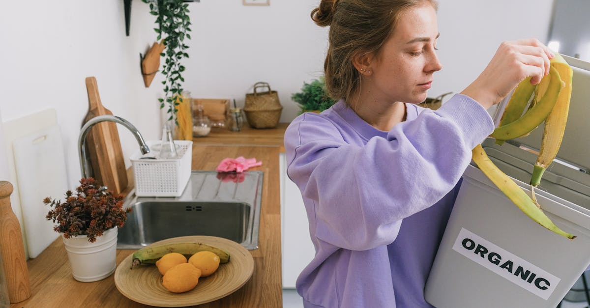 a woman composts banana peels in an indoor organic bin promoting sustainable living 1