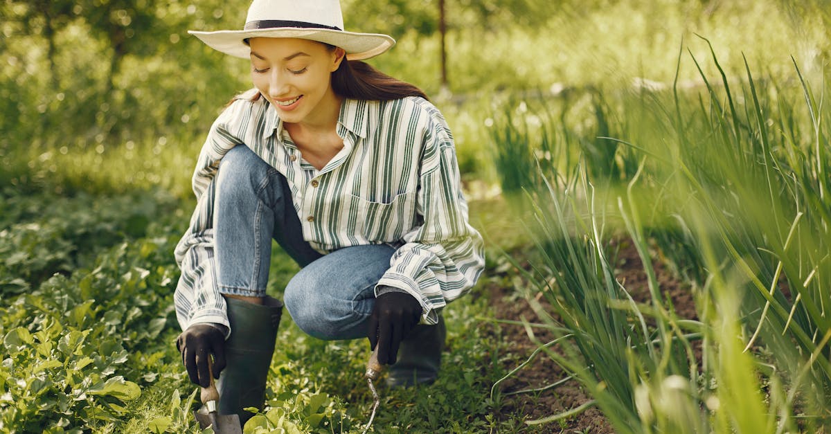 a woman joyfully tending to a garden surrounded by lush greenery on a sunny day