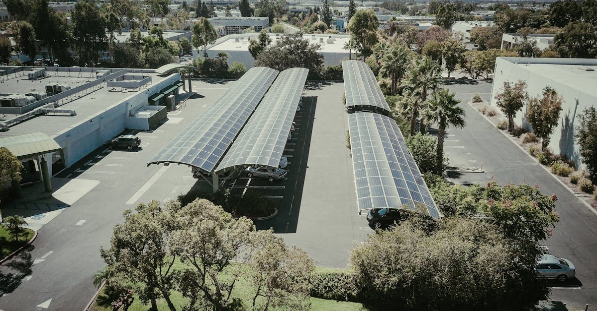 aerial shot of solar panel installations in a suburban neighborhood under clear skies