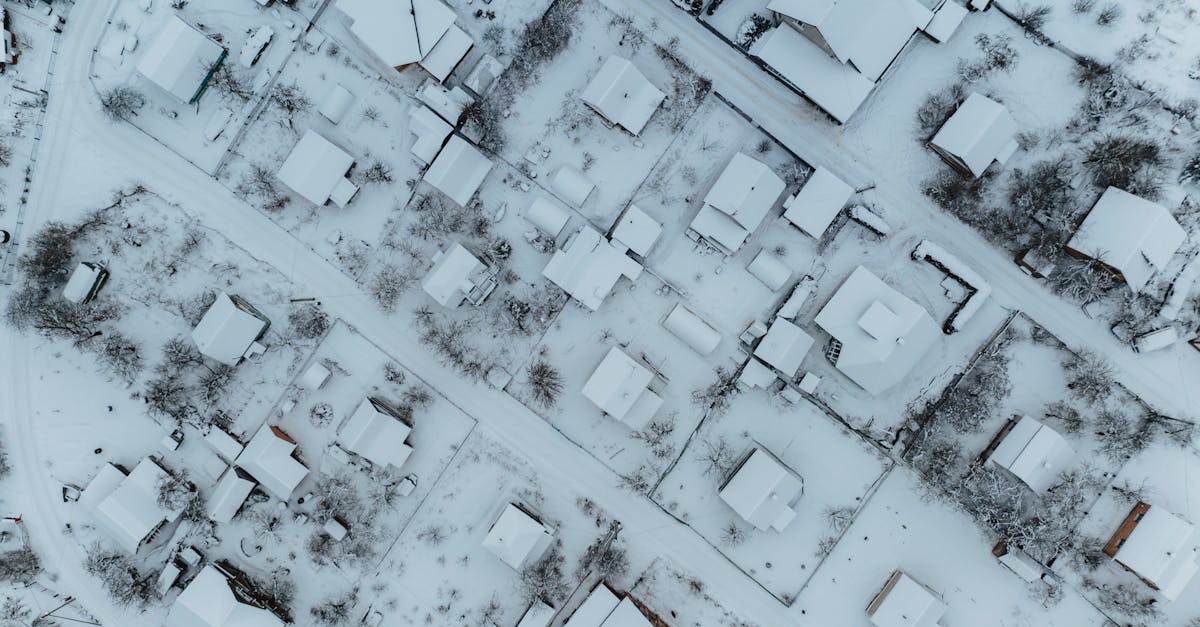 aerial view of a snow blanketed neighborhood in minski rajon belarus seen during winter day