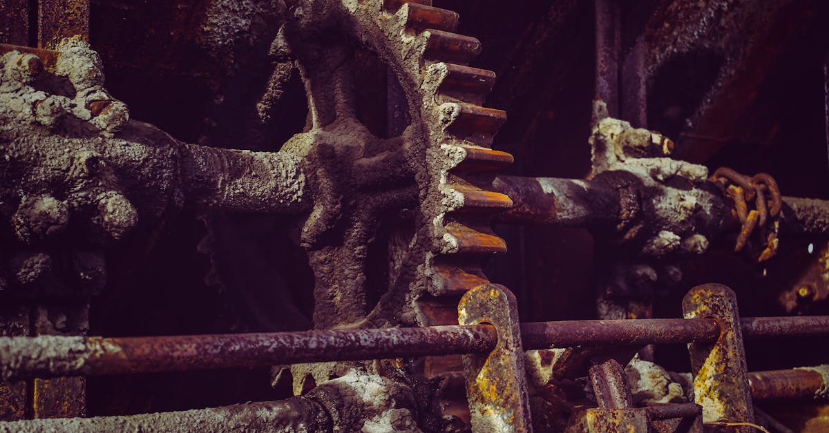 aged rough metal pipes with corrosion on surface and ribbed valve with dense texture covered with pl