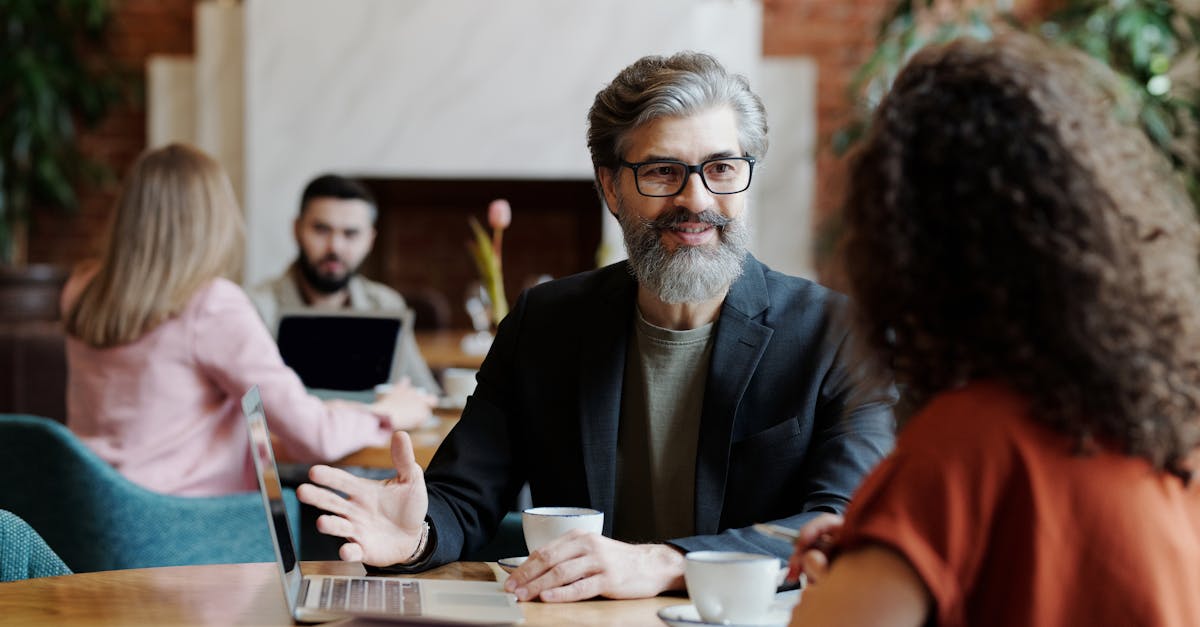 business professionals having a discussion over coffee in a modern cafe setting 3