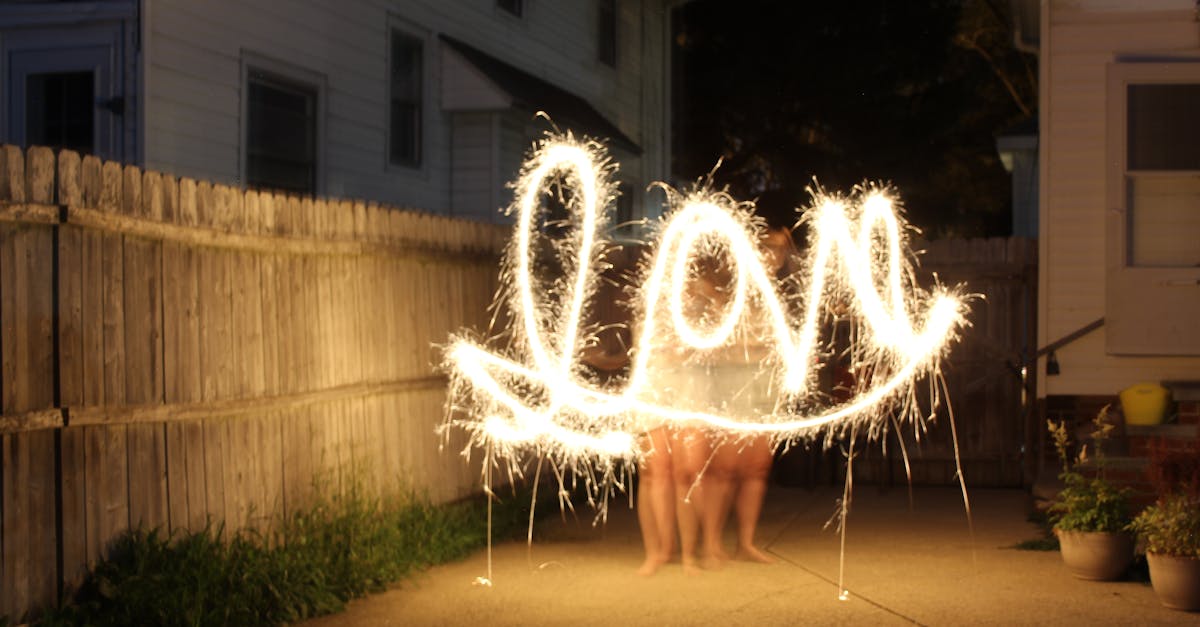 captivating nighttime sparkler art spelling love in a cozy backyard setting