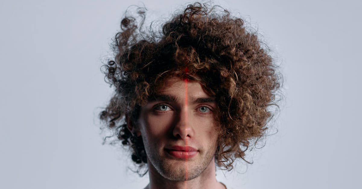 close up headshot of a male with curly hair and laser scanning lines on face 1