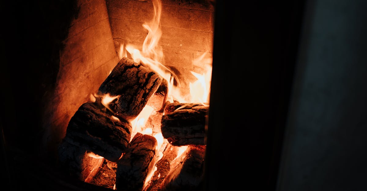 close up of burning logs in a warm cozy fireplace perfect for a relaxing at home ambiance