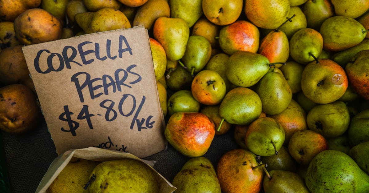 close up of corella pears with price tag at a market showcasing their fresh and juicy appeal