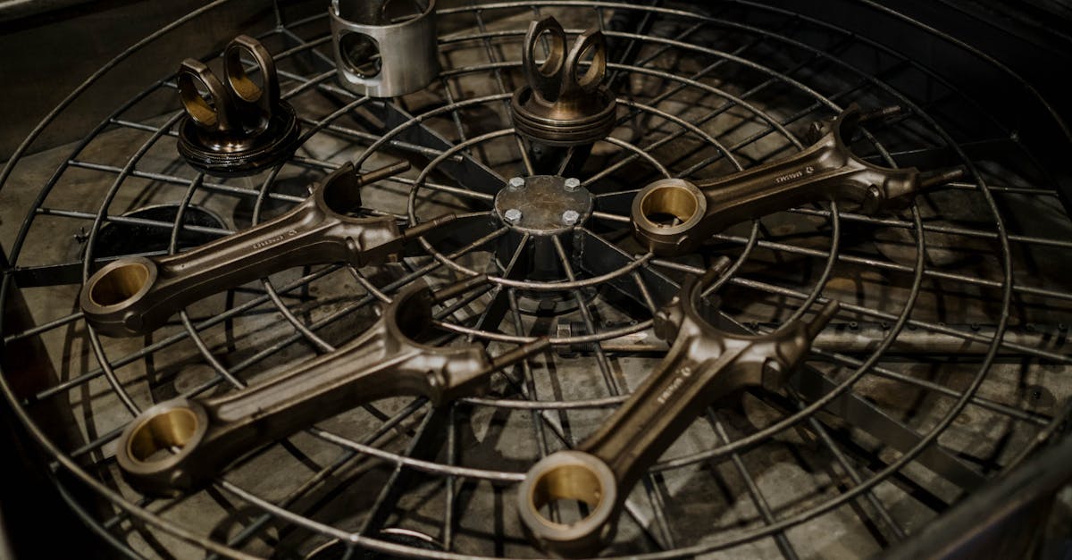 detailed arrangement of mechanical spare parts on a metal grid in an industrial setting