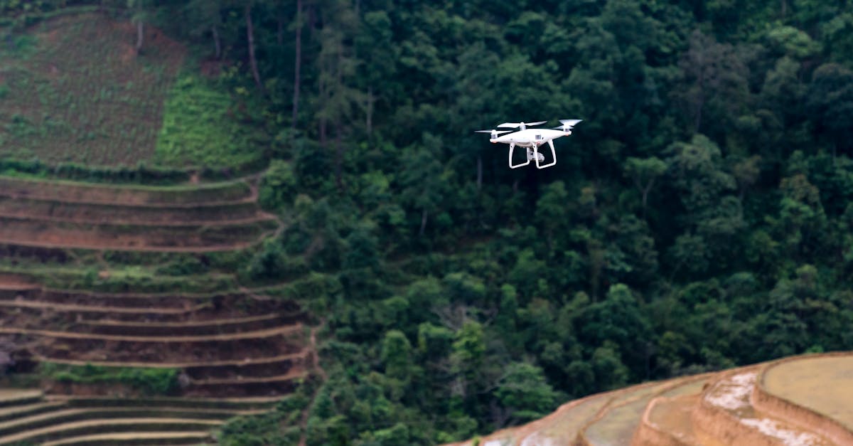 drone flying over green rice terraces showcasing vibrant nature and advanced agriculture technology
