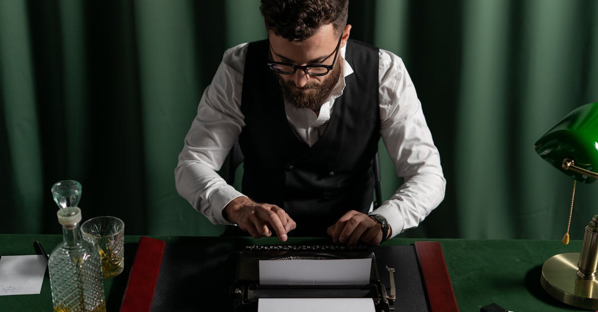 man in a vintage office typing on a typewriter with a focused expression under warm lighting