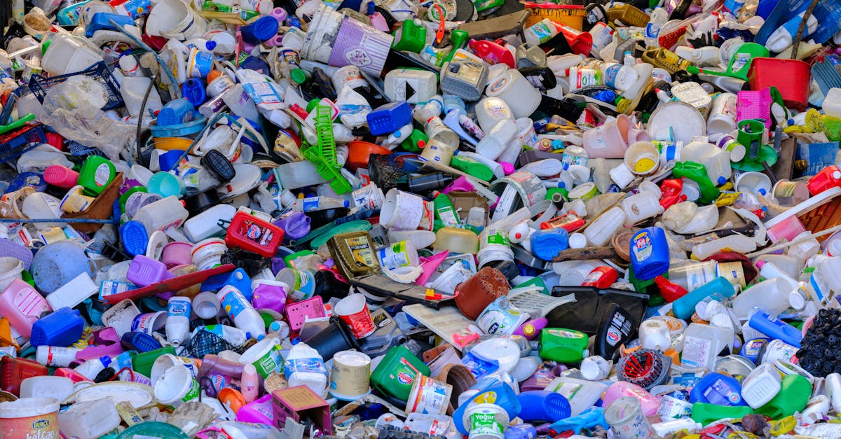 massive colorful collection of used plastic bottles and containers in a recycling center