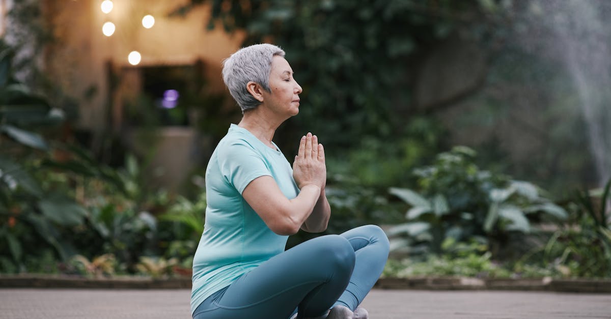 senior woman practicing yoga outdoors in a serene garden setting embodying peace and mindfulness 1