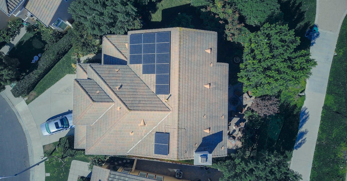 top down aerial view of a house with solar panels showcasing modern renewable energy solutions