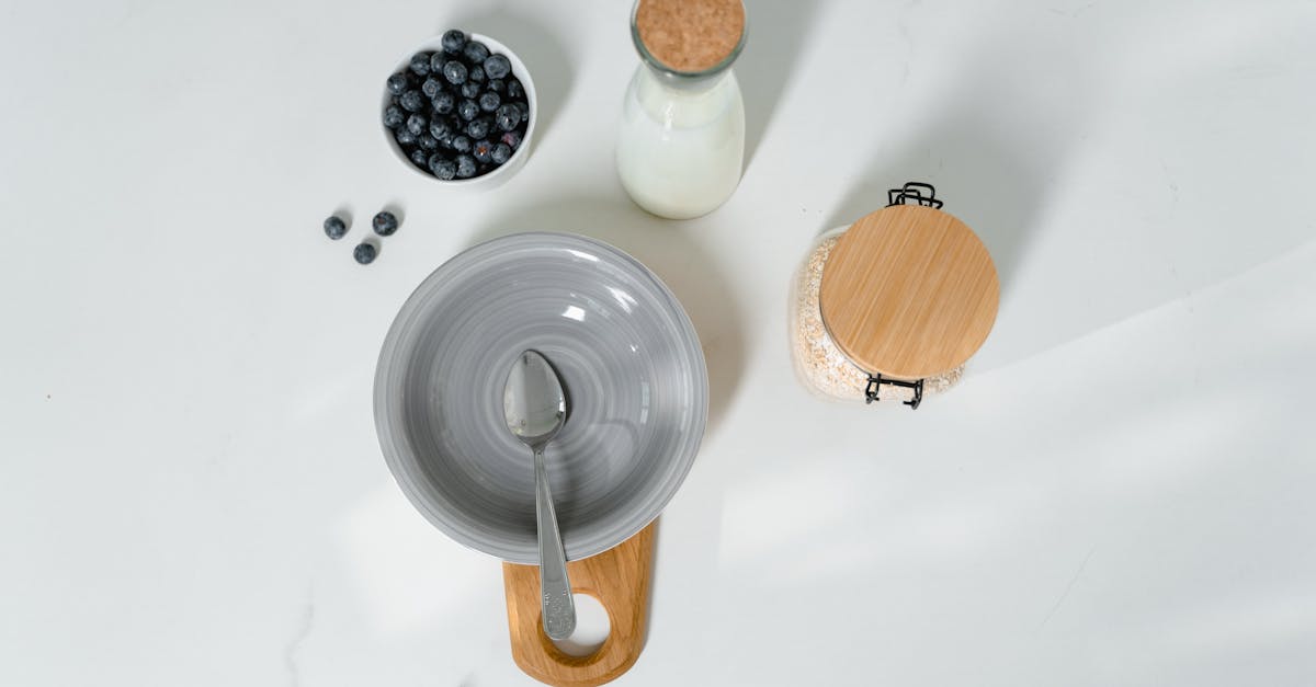 top view of a healthy breakfast setup with milk blueberries and oats