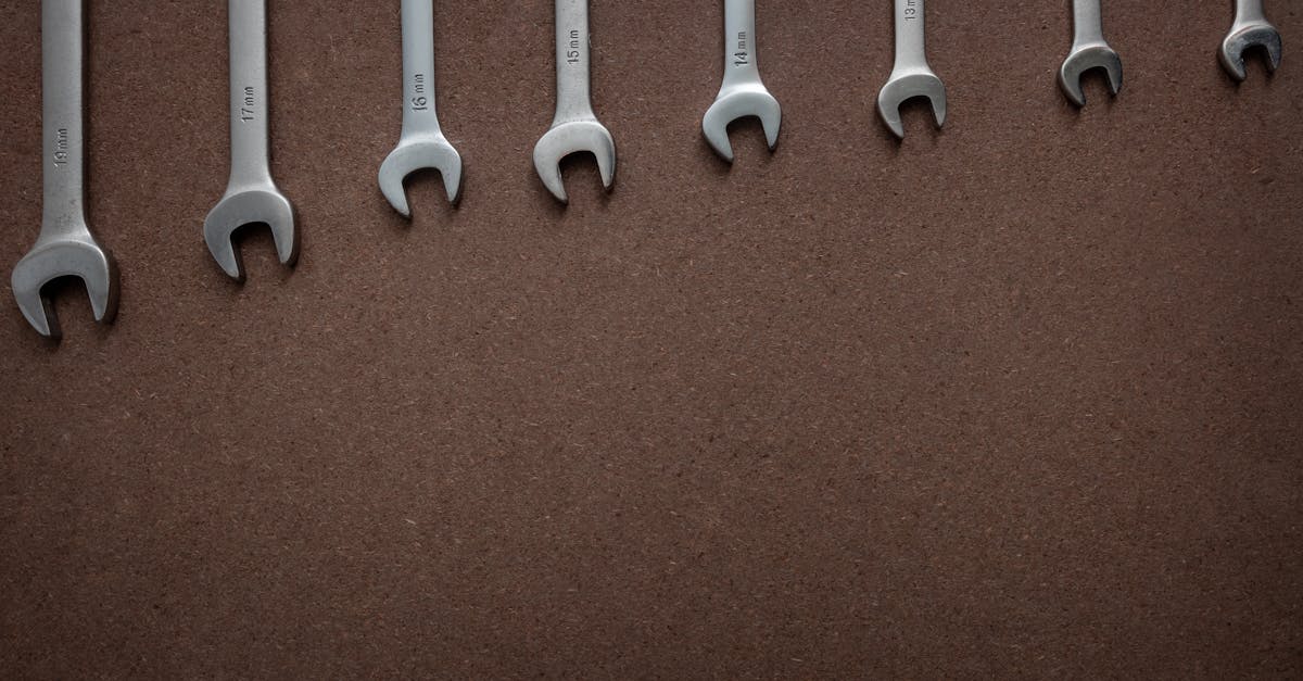 top view of wrenches lined up on a textured brown surface showcasing sizes 2
