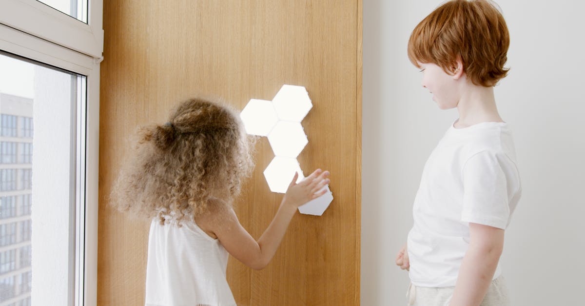 two kids engage with hexagonal led wall lights indoors 1