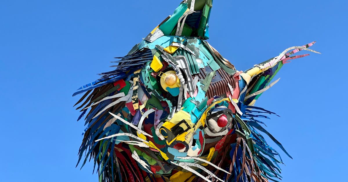 vibrant sculpture of a fox made from recycled metal pieces set against a clear blue sky 1