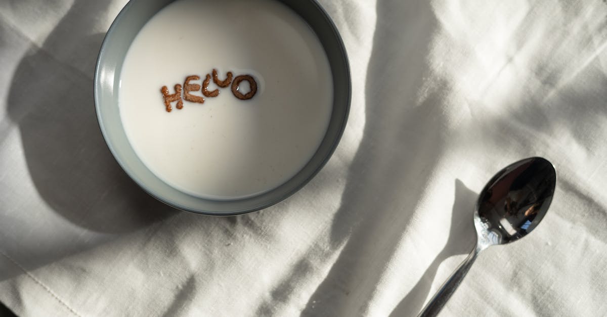 cereal letters spelling hello in milk captured in a minimalist flatlay shot