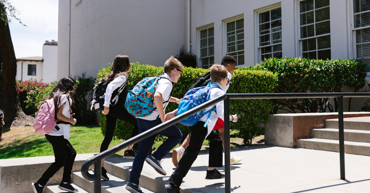 children joyfully running up steps to school backpacks in tow showcasing school life