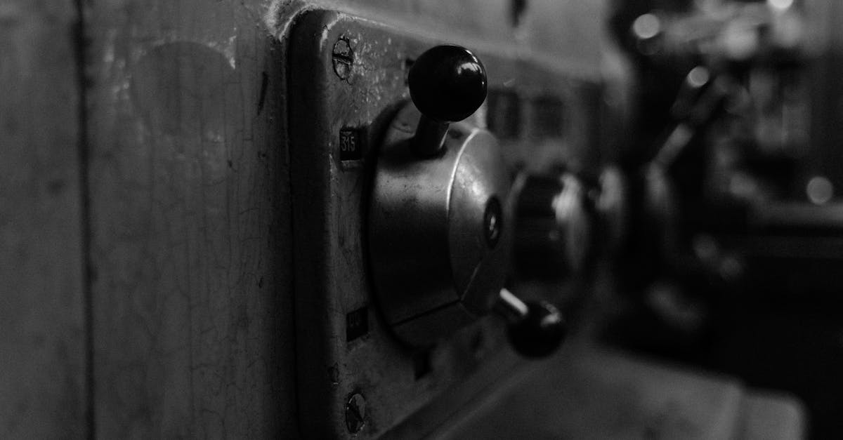 detailed view of vintage machine control panel in black and white