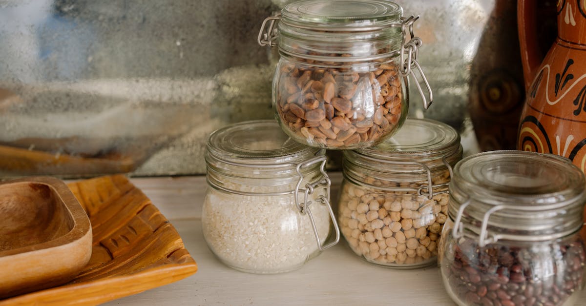 elegant kitchen scene with glass jars of chickpeas rice and beans on a wooden counter