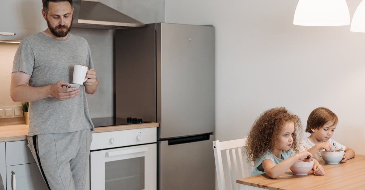 man and children having breakfast in a cozy kitchen setting