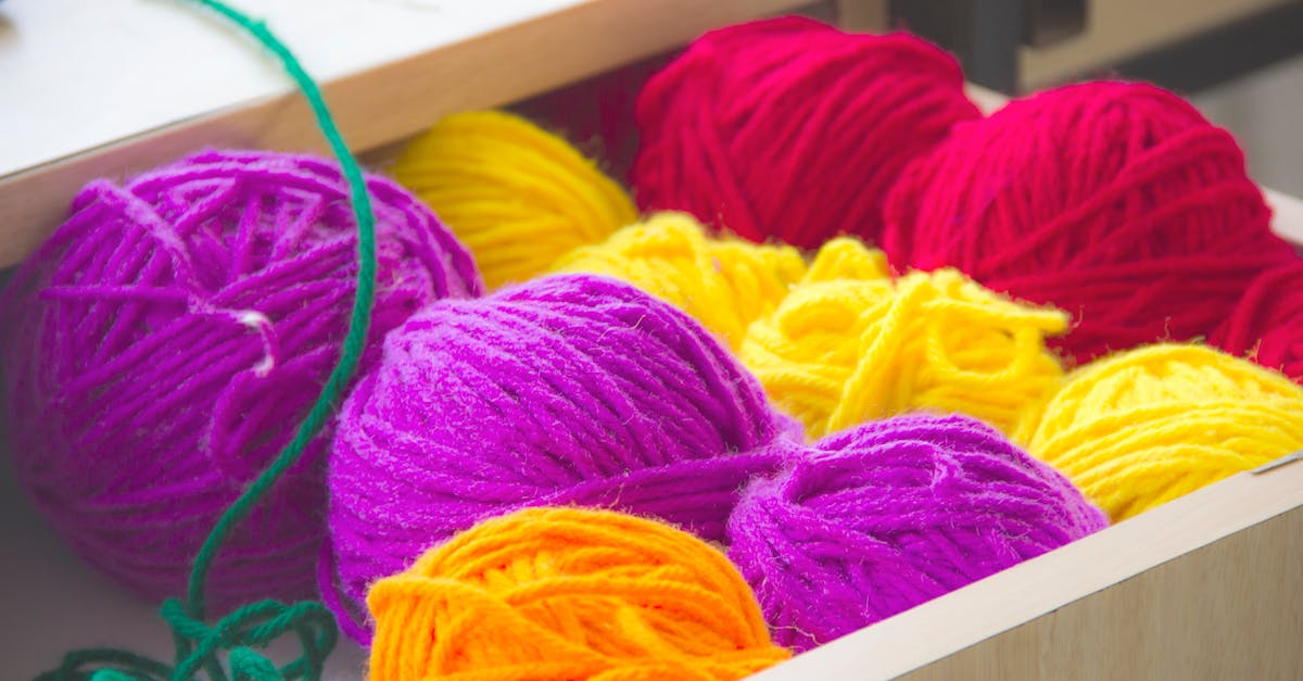 vibrant and colorful yarn balls neatly organized in a drawer perfect for knitting and textile proje