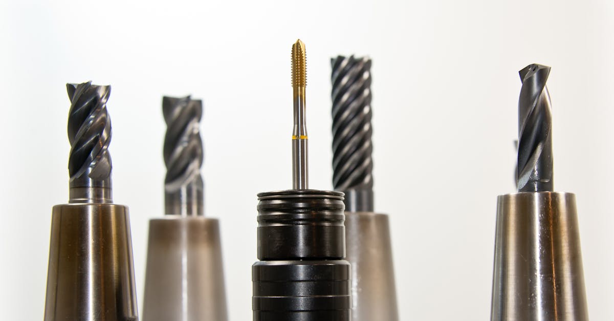a close up view of metal drill bits arranged vertically showcasing industrial tools