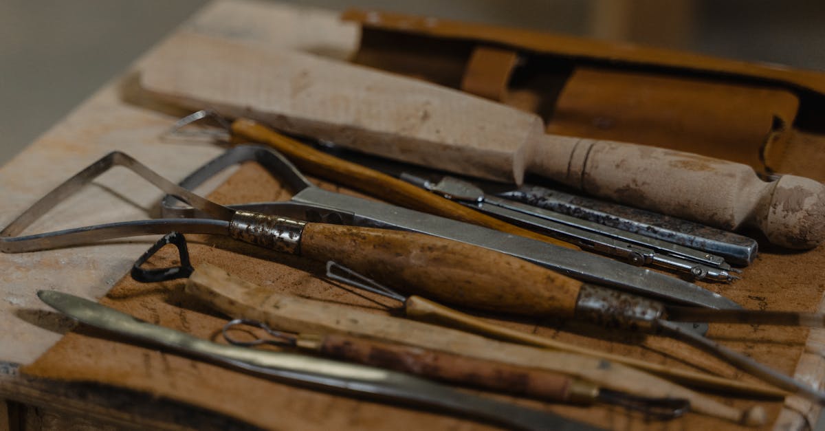 a collection of artisan tools arranged on a workshop table showcasing craftsmanship