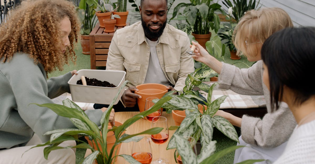 a diverse group of adults engaging in a fun indoor gardening session with potted plants
