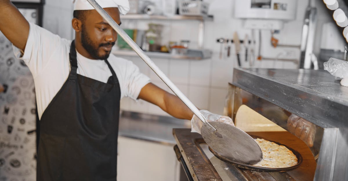 a skilled chef using a pizza peel to place a delicious pizza in a traditional oven