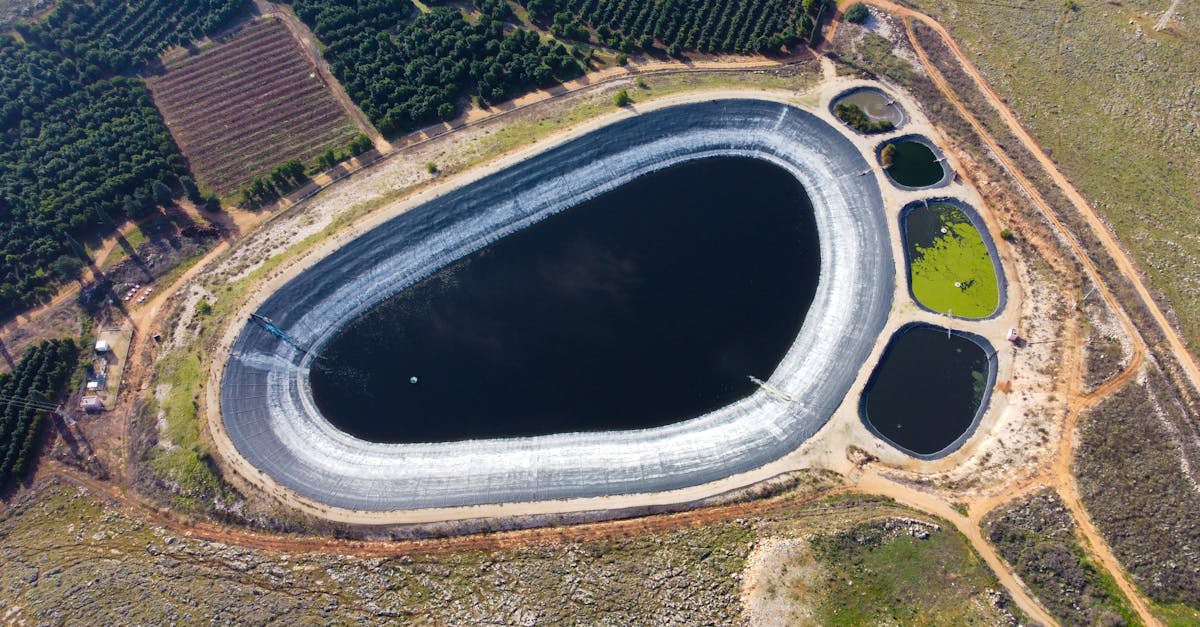 aerial shot of a reservoir and farmland showing irrigation ponds and planted fields