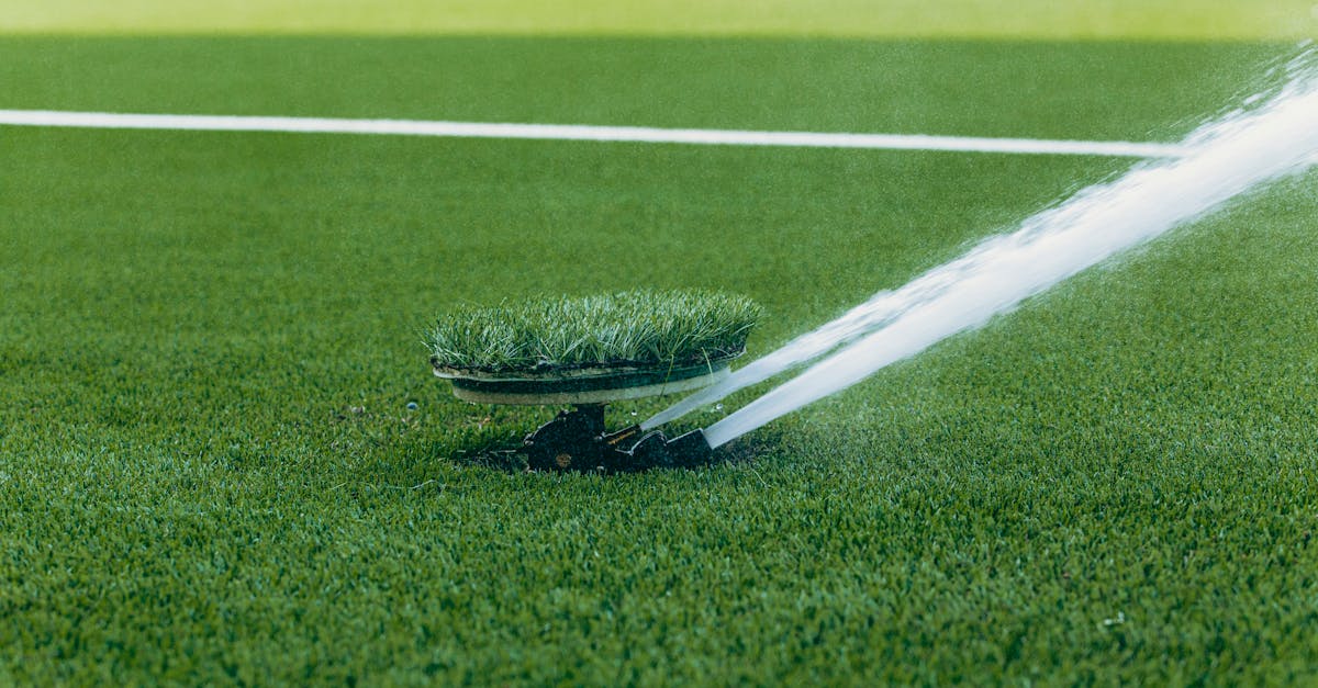 an active sprinkler watering a vibrant green sports field enhancing the lush grass surface 5