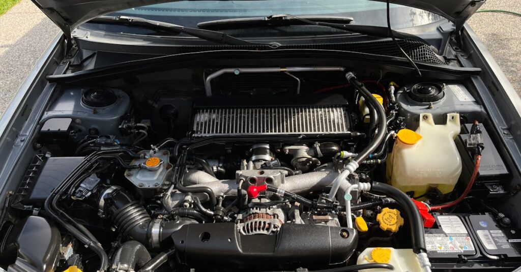 close up view of car engine with visible components under the open hood 1