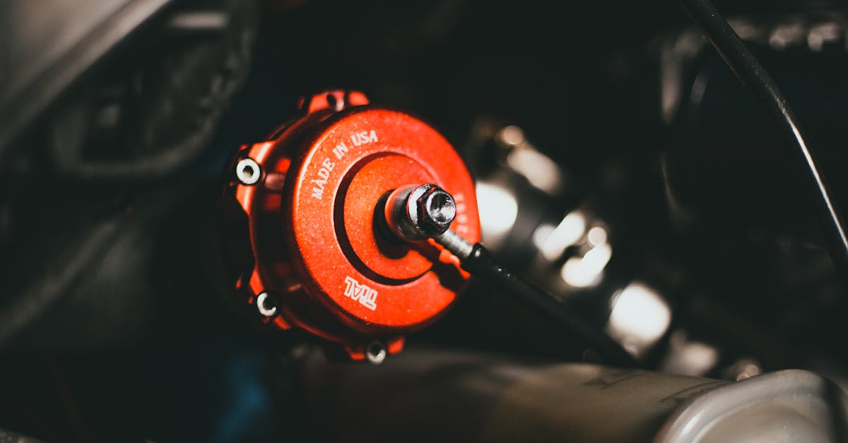 detailed view of a red valve in a car engine highlighting precision engineering