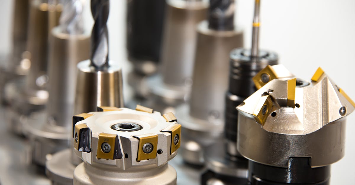 detailed view of various metal drill bits and tools arranged in a workshop setting 2