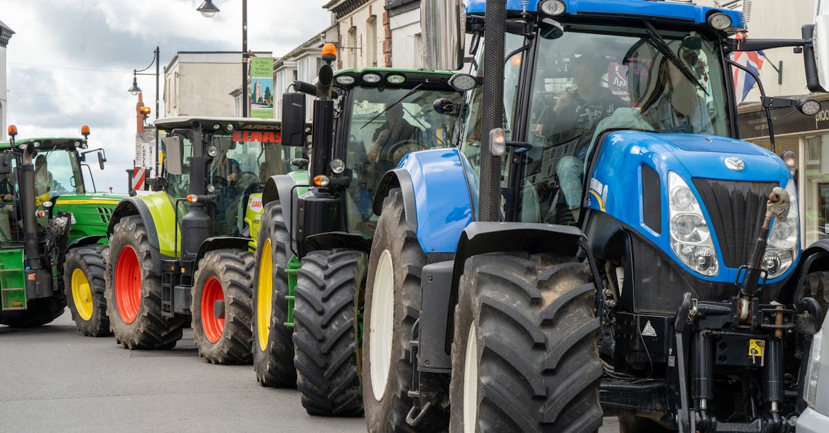 lineup of vibrant tractors on a street in holsworthy england showcasing agricultural machinery 1