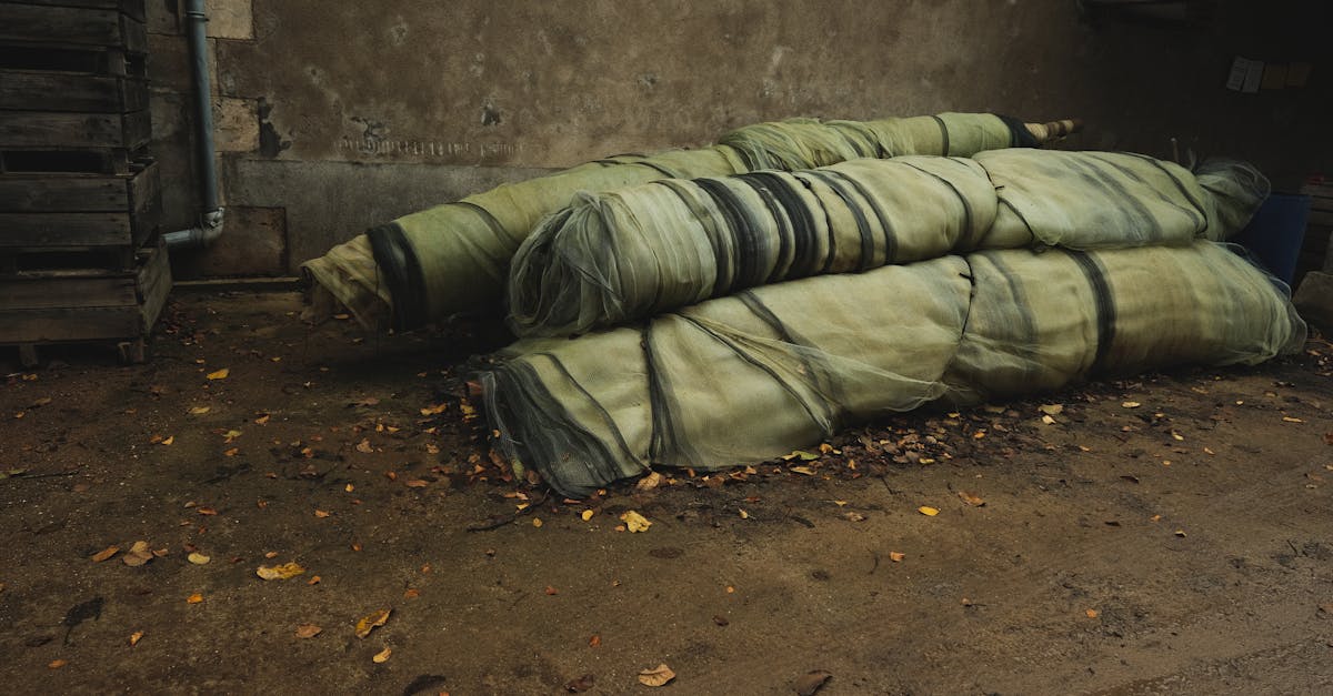 stacked industrial nets in a rustic outdoor setting surrounded by fallen leaves