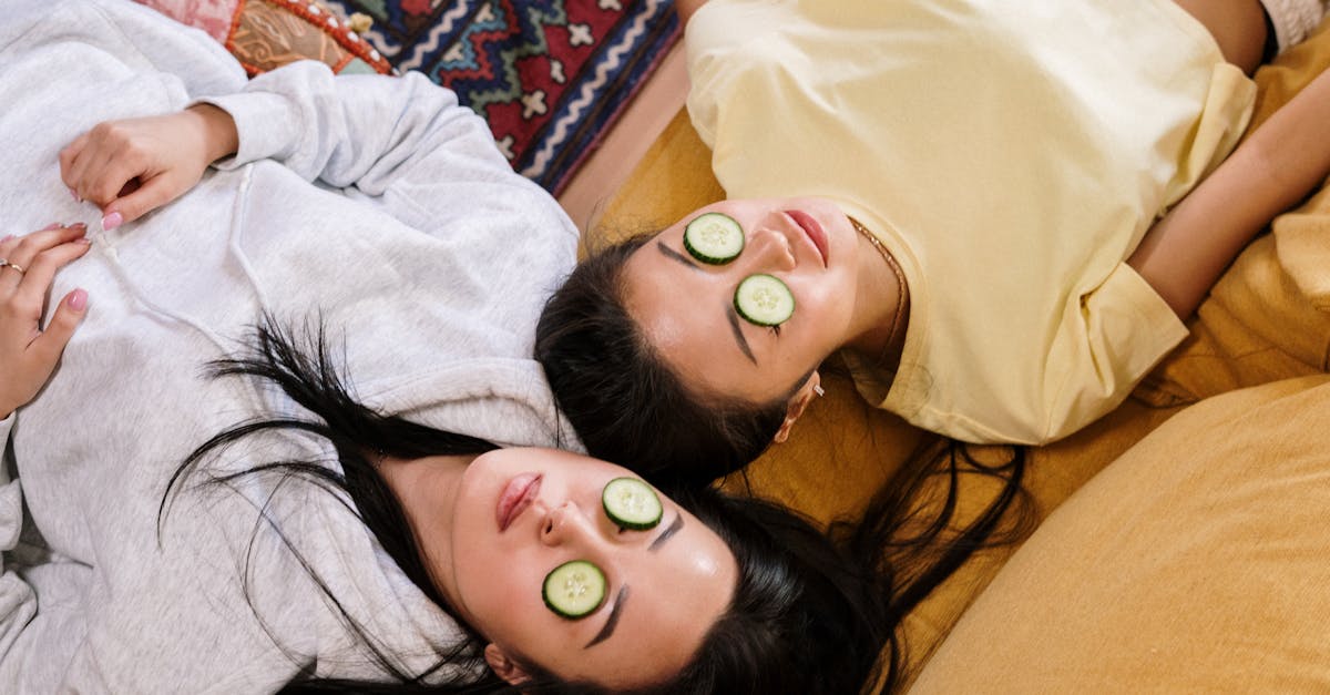 two friends relaxing at home with cucumber masks in a cozy setting enjoying a diy skincare session