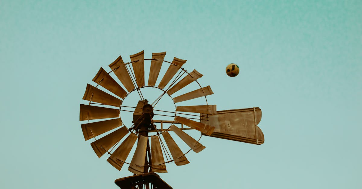 windmill with ball flying in clear blue sky rustic and vintage feel ideal for outdoor and summer t